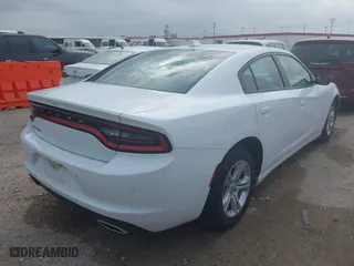 2023 Dodge Charger SXT with VIN 2C3CDXBG2PH530257, listed as a IAAI auction lot 42067908 with 56,294 mi miles. Bid and sale history available at carsss.com. Image 4.