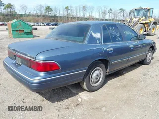 1996 Mercury Grand Marquis GS with VIN 2MELM74W8TX697141, listed as a IAAI auction lot 42082750 with 138,963 mi miles and . Bid and sale history available at DreamBid. Image 4.