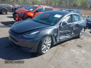 2018 Tesla Model 3 Long Range Battery with VIN 5YJ3E1EBXJF055203, listed as a IAAI auction lot 42019770 with 57,379 mi miles and . Bid and sale history available at DreamBid. Image 17.