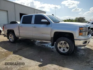 2015 Chevrolet Silverado 1500 LT with VIN 3GCUKREC9FG433906, listed as a Copart auction lot 52495785 with 99,268 mi miles and Salvage Title. Bid and sale history available at DreamBid. Image 4.
