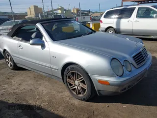 1999 Mercedes-Benz CLK with VIN WDBLK65G6XT006151, listed as a IAAI auction lot 41597025 with 230,751 mi miles. Bid and sale history available at carsss.com. Image 1.