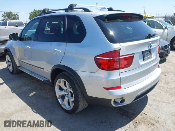 2012 BMW X5 35d with VIN 5UXZW0C58CL671141, listed as a IAAI auction lot 42644381 with 127,464 mi miles and . Bid and sale history available at DreamBid. Image 3.