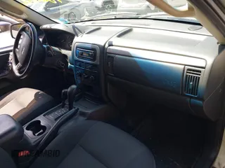 2004 Jeep Grand Cherokee Laredo with VIN 1J4GW48S54C314056, listed as a IAAI auction lot 42096065 with 164,113 mi miles. Bid and sale history available at carsss.com. Image 5.