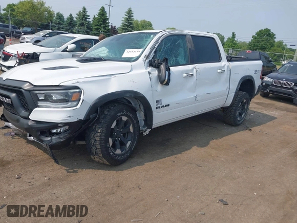 2022 Ram 1500 Rebel with VIN 1C6SRFLT5NN318494, listed as a IAAI auction lot 42413194 with 59,458 mi miles and . Bid and sale history available at DreamBid. Image 2.