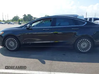2016 Ford Fusion Titanium with VIN 3FA6P0K90GR333848, listed as a IAAI auction lot 42728138 with 147,864 mi miles and . Bid and sale history available at DreamBid. Image 14.