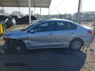 2023 Kia Rio LX with VIN 3KPA24AD1PE599290, listed as a IAAI auction lot 41023283 with 10,027 mi miles and . Bid and sale history available at DreamBid. Image 14.