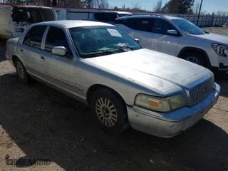 2007 Mercury Grand Marquis LS with VIN 2MEFM75V77X601170, listed as a IAAI auction lot 41517369 with 210,800 mi miles. Bid and sale history available at carsss.com. Image 1.