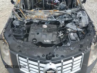 2015 Cadillac SRX Luxury Collection z VIN 3GYFNBE31FS612780, wystawiony jako Copart lot #56149815 z przebiegiem Nie podano mil oraz Nie do naprawy • Non repairable. Historia ofert i sprzedaży dostępna na DreamBid. Obrazek 12.