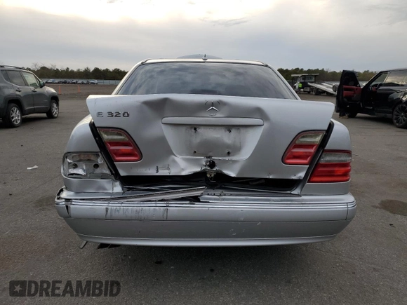 2000 Mercedes-Benz E-Class with VIN WDBJF65J8YB153103, listed as a Copart auction lot 80986234 with 144,205 mi miles and Salvage Title. Bid and sale history available at carsss.com. Image 6.