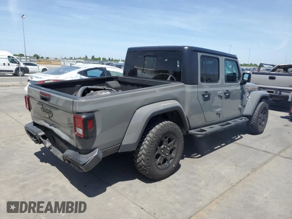 2023 Jeep Gladiator Sport S with VIN 1C6HJTAG3PL552959, listed as a Copart auction lot 56905635 with 30,356 mi miles and Salvage title. Bid and sale history available at DreamBid. Image 3.