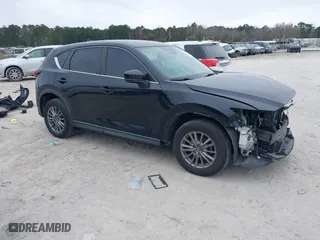 2017 Mazda CX-5 Sport with VIN JM3KFBBL5H0163935, listed as a IAAI auction lot 41186728 with 106,999 mi miles. Bid and sale history available at carsss.com. Image 1.