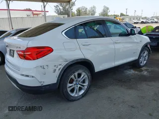 2015 BMW X4 xDrive28i with VIN 5UXXW3C5XF0M89259, listed as a IAAI auction lot 42553903 with 98,960 mi miles and . Bid and sale history available at DreamBid. Image 4.
