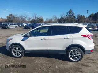 2016 Ford Escape Titanium with VIN 1FMCU9J96GUB65441, listed as a IAAI auction lot 41412223 with 74,218 mi miles. Bid and sale history available at carsss.com. Image 14.