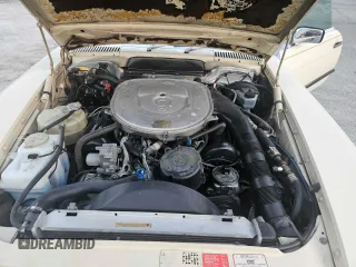 1987 Mercedes-Benz 560 with VIN WDBBA48D5HA061899, listed as a Copart auction lot 76554184 with 68,292 mi miles and Salvage Title. Bid and sale history available at carsss.com. Image 7.