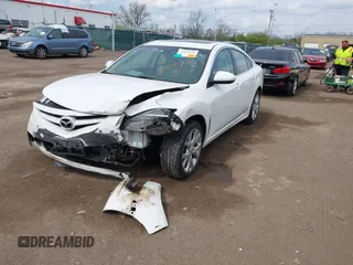 2009 Mazda 6 S Grand Touring with VIN 1YVHP82B995M09281, listed as a IAAI auction lot 42060946 with 102,423 mi miles and . Bid and sale history available at DreamBid. Image 2.
