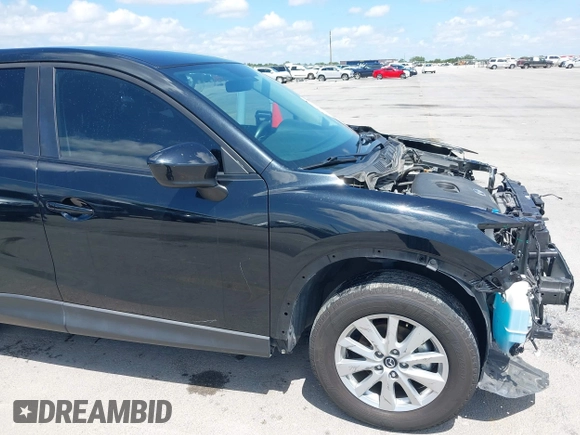 2014 Mazda CX-5 Sport with VIN JM3KE2BE9E0402015, listed as a IAAI auction lot 42098197 with 65,328 mi miles and . Bid and sale history available at carsss.com. Image 19.