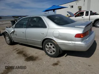 2000 Toyota Camry LE z VIN JT2BF28K0Y0261092, wystawiony jako Copart lot #58008665 z przebiegiem Nie podano mil oraz Szkoda całkowita • Salvage title. Historia ofert i sprzedaży dostępna na DreamBid. Obrazek 2.