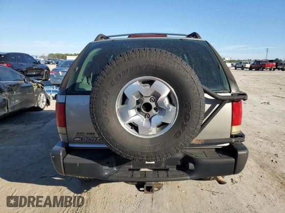 2004 Chevrolet Blazer LS z VIN 1GNCT18X94K116116, wystawiony jako Copart lot #42378015 z przebiegiem 112 272 mil mil oraz Czysty tytuł • Clean title. Historia ofert i sprzedaży dostępna na DreamBid. Obrazek 6.