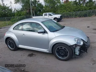 2012 Volkswagen Beetle 2.5L with VIN 3VWJX7AT9CM608065, listed as a IAAI auction lot 41864342 with 77,038 mi miles. Bid and sale history available at carsss.com. Image 13.