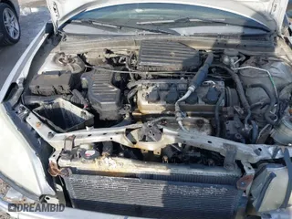 2005 Honda Civic LX with VIN 1HGEM215X5L064781, listed as a IAAI auction lot 41443405 with 303,293 mi miles. Bid and sale history available at carsss.com. Image 10.