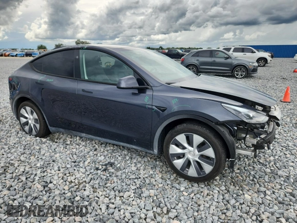 2024 Tesla Model Y Long Range with VIN 7SAYGDEE9RA255688, listed as a Copart auction lot 58918665 with 21,302 mi miles and Salvage title. Bid and sale history available at DreamBid. Image 4.