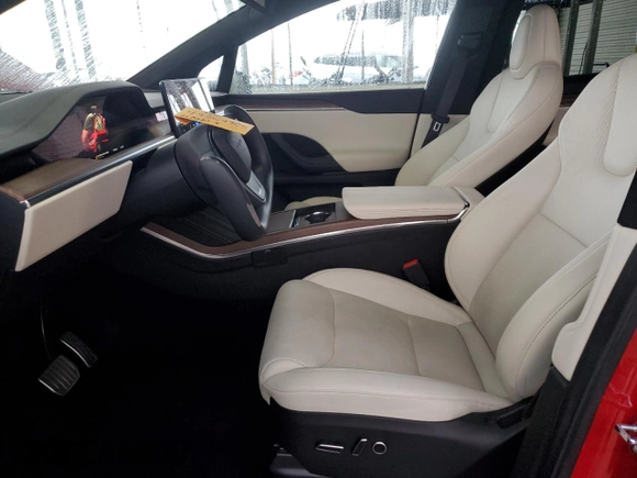 2023 Tesla Model X with VIN 7SAXCBE52PF365140, listed as a Copart auction lot 44564965 with 27,107 mi miles and Salvage Title. Bid and sale history available at DreamBid. Image 7.