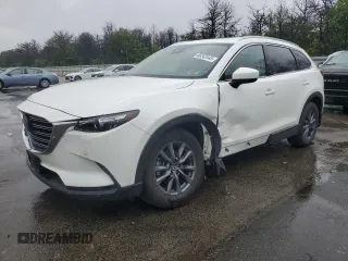 2021 Mazda CX-9 Touring z VIN JM3TCBCY1M0536616, wystawiony jako Copart lot #60242445 z przebiegiem 40 057 mil mil oraz Szkoda całkowita • Salvage title. Historia ofert i sprzedaży dostępna na DreamBid. Obrazek 1.
