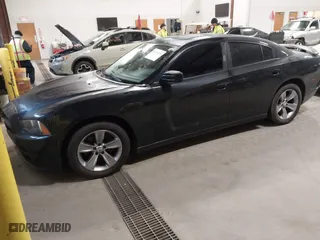2011 Dodge Charger RT Plus with VIN 2B3CL5CT9BH511648, listed as a IAAI auction lot 41734392 with 103,112 mi miles. Bid and sale history available at carsss.com. Image 2.