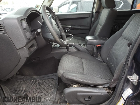 2010 Jeep Commander Sport with VIN 1J4RG4GK5AC119433, listed as a Copart auction lot 87657265 with 212,973 mi miles and Salvage title. Bid and sale history available at DreamBid. Image 7.