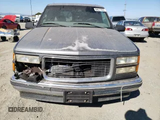 1999 GMC Yukon with VIN 1GKEC13R5XJ761595, listed as a Copart auction lot 69677904 with 174,735 mi miles and Clean Title. Bid and sale history available at carsss.com. Image 5.