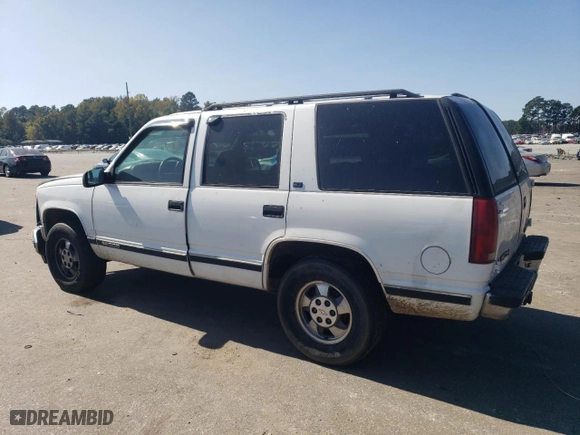 1996 GMC Yukon with VIN 1GKEK13R1TJ750705, listed as a Copart auction lot 76251474 with 245,084 mi miles and Salvage Title. Bid and sale history available at carsss.com. Image 2.