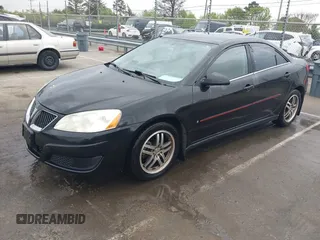 2009 Pontiac G6 1SB with VIN 1G2ZJ57B594263412, listed as a IAAI auction lot 41844953 with 234,057 mi miles and . Bid and sale history available at DreamBid. Image 2.