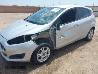 2014 Ford Fiesta SE with VIN 3FADP4EJ4EM151911, listed as a IAAI auction lot 42096321 with 129,938 mi miles and . Bid and sale history available at DreamBid. Image 6.