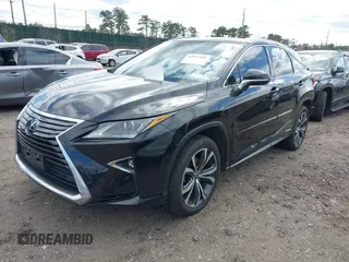 2018 Lexus RX with VIN 2T2BGMCA0JC024236, listed as a IAAI auction lot 42032485 with 105,046 mi miles. Bid and sale history available at carsss.com. Image 2.