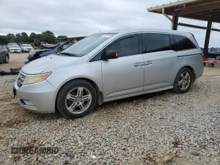 2011 Honda Odyssey Touring with VIN 5FNRL5H94BB063041, listed as a Copart auction lot 61016275 with 232,575 mi miles and Salvage title. Bid and sale history available at DreamBid. Image 1.