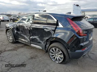 2021 Cadillac XT4 AWD Premium Luxury with VIN 1GYFZDR4XMF016846, listed as a Copart auction lot 82963704 with 44,063 mi miles and Salvage Title. Bid and sale history available at carsss.com. Image 2.