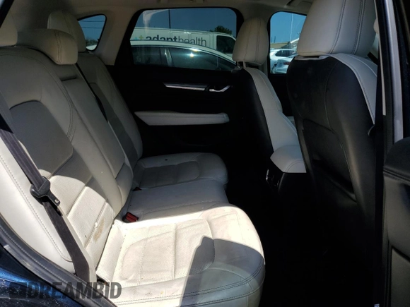 2018 Mazda CX-5 Grand Touring с VIN JM3KFBDM8J0344328, выставлен на аукционе Copart как лот 57665175 с пробегом 131 175 миль миль и Списание • Salvage title. История ставок и продаж доступна на DreamBid. Изображение 11.