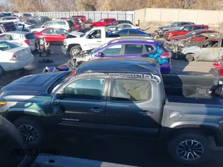 2023 Toyota Tacoma SR with VIN 3TMCZ5AN2PM553928, listed as a IAAI auction lot 40999044 with 9,210 mi miles and . Bid and sale history available at DreamBid. Image 14.