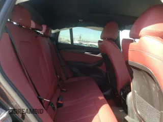2022 BMW X4 xDrive30i z VIN 5UX33DT01N9L78188, wystawiony jako Copart lot #57873752 z przebiegiem 5 151 mil mil oraz . Historia ofert i sprzedaży dostępna na DreamBid. Obrazek 6.