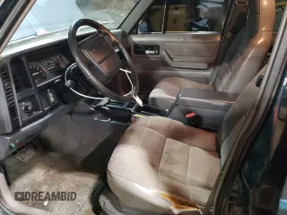 1996 Jeep Cherokee Sport with VIN 1J4FJ68S1TL226495, listed as a Copart auction lot 58587685 with 205,397 mi miles and Salvage title. Bid and sale history available at DreamBid. Image 7.