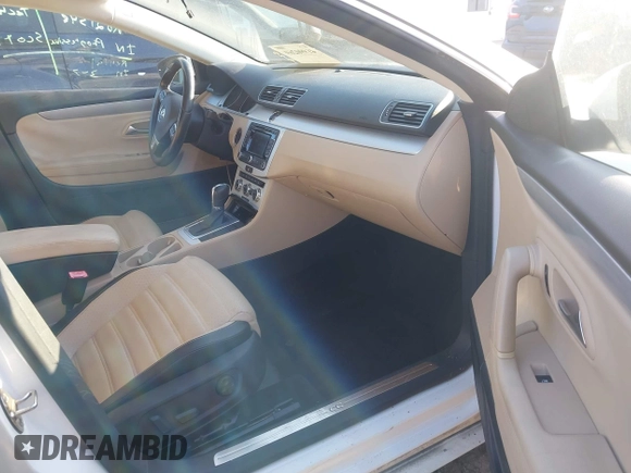 2014 Volkswagen CC R-Line with VIN WVWBP7AN0EE504680, listed as a IAAI auction lot 41990269 with 137,660 mi miles. Bid and sale history available at carsss.com. Image 5.