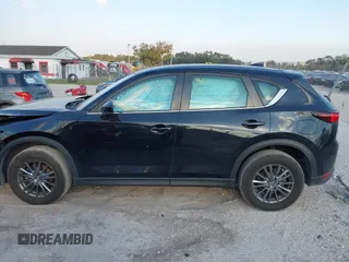 2019 Mazda CX-5 Sport with VIN JM3KFABMXK0693540, listed as a IAAI auction lot 41523569 with 57,895 mi miles and . Bid and sale history available at DreamBid. Image 14.