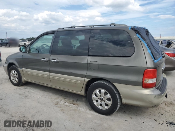2004 Kia Sedona LX with VIN KNDUP131346575851, listed as a Copart auction lot 73614194 with 153,928 mi miles and Salvage Title. Bid and sale history available at carsss.com. Image 2.