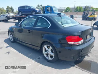 2011 BMW 1 Series 128i with VIN WBAUP9C51BVL90277, listed as a IAAI auction lot 42572690 with 153,427 mi miles and . Bid and sale history available at DreamBid. Image 3.