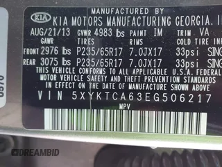 2014 Kia Sorento LX with VIN 5XYKTCA63EG506217, listed as a IAAI auction lot 42050413 with 126,806 mi miles and . Bid and sale history available at carsss.com. Image 9.