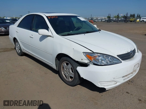 2002 Toyota Camry XLE z VIN 4T1BF32K22U032074, wystawiony jako IAAI lot #42153774 z przebiegiem 293 541 mil mil oraz . Historia ofert i sprzedaży dostępna na DreamBid. Obrazek 1.