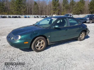 1999 Ford Taurus SE z VIN 1FAFP53S0XA102036, wystawiony jako Copart lot #43810035 z przebiegiem 228 136 mil mil oraz Szkody całkowita. Historia ofert i sprzedaży dostępna na DreamBid. Obrazek 1.