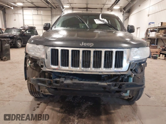 2011 Jeep Grand Cherokee 70th Anniversary with VIN 1J4RR4GG3BC745652, listed as a IAAI auction lot 41133698 with 217,948 mi miles. Bid and sale history available at carsss.com. Image 6.