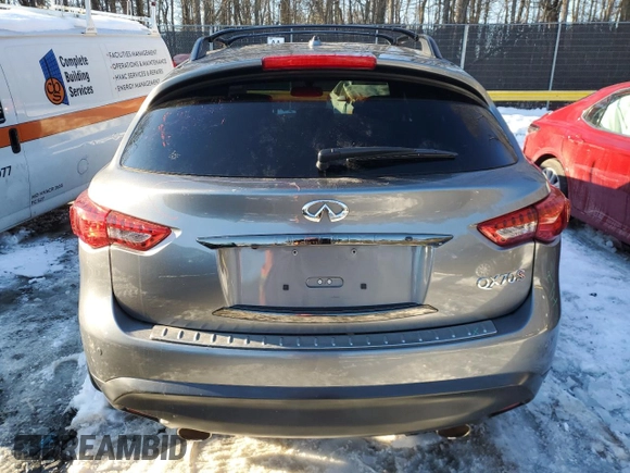 2015 Infiniti QX70 z VIN JN8CS1MW2FM481841, wystawiony jako Copart lot #41459505 z przebiegiem Nie podano mil oraz Szkoda całkowita • Salvage title. Historia ofert i sprzedaży dostępna na DreamBid. Obrazek 6.