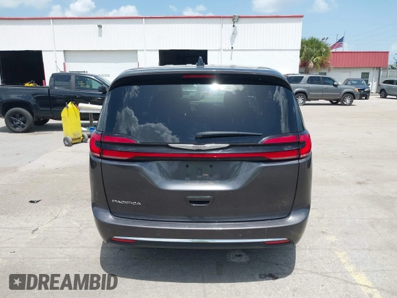 2023 Chrysler Pacifica Touring L with VIN 2C4RC1BG6PR590302, listed as a IAAI auction lot 42451369 with 72,097 mi miles and . Bid and sale history available at DreamBid. Image 16.